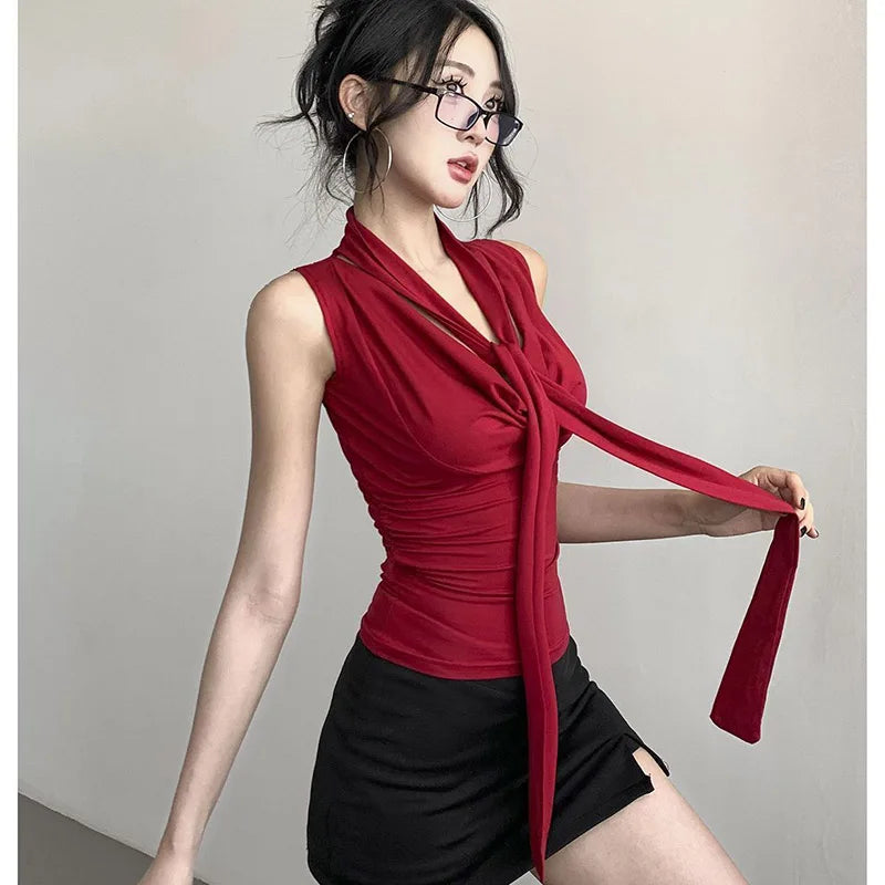 Solid halter-neck pleated camisole with satin ribbon. Sexy V-neck, sleeveless, slim-fit. Perfect for summer office wear.